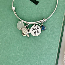 Load image into Gallery viewer, beach girl, stainless steel adjustable engraved beach bangle bracelet with pewter sea turtle charm, genuine sea glass & crystal birthstone