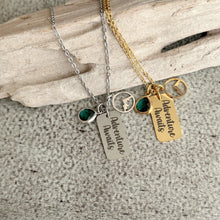 Load image into Gallery viewer, Adventure Awaits - Engraved stainless steel necklace - silver or gold with mountain charm and emerald green glass gem