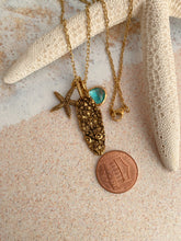 Load image into Gallery viewer, Gold beach charm necklace - starfish, barnacle shell charm and teal glass charm