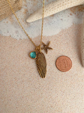 Load image into Gallery viewer, Gold beach charm necklace - starfish, barnacle shell charm and teal glass charm