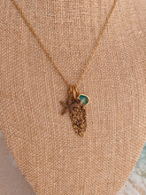 Load image into Gallery viewer, Gold beach charm necklace - starfish, barnacle shell charm and teal glass charm