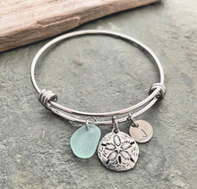 Load image into Gallery viewer, sand dollar charm bracelet, stainless steel adjustable bangle with genuine sea glass, and hand stamped initial disc Beach glass jewelry
