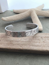 Load image into Gallery viewer, Beach Cuff bracelet - hand stamped silver aluminum - Seashells and Sand dollars - Tropical Beach gift - gift for beach lover gift for friend