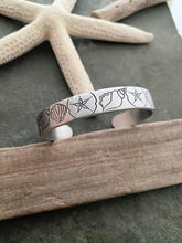 Load image into Gallery viewer, Beach Cuff bracelet - hand stamped silver aluminum - Seashells and Sand dollars - Tropical Beach gift - gift for beach lover gift for friend