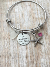 Load image into Gallery viewer, it matters to this one, stainless steel adjustable bangle bracelet, starfish charm, genuine sea glass and Swarovski birthstone, teacher gift