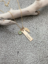 Load image into Gallery viewer, Gold tone necklace with birthstone crystal, bar with name and angel wing charm