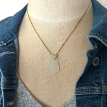 Load image into Gallery viewer, Frosty White Sea glass pendant with gold brass heart bail and stainless steel chain
