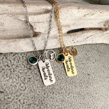 Load image into Gallery viewer, Adventure Awaits - Engraved stainless steel necklace - silver or gold with mountain charm and emerald green glass gem
