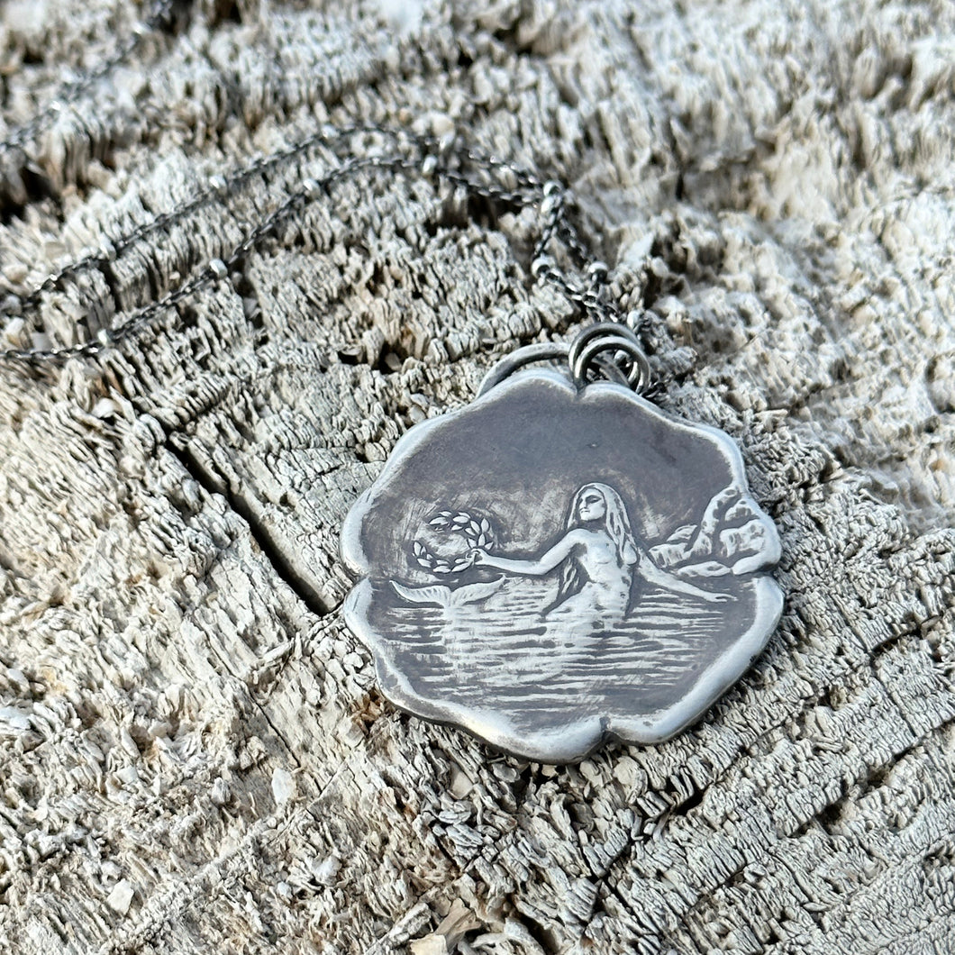 Fine Silver Mermaid holding laurel wreath pendant necklace