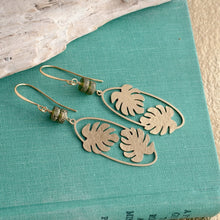 Load image into Gallery viewer, long Brass Monstera leaf Earrings - Gold textured brass and Green glass dangle earrings
