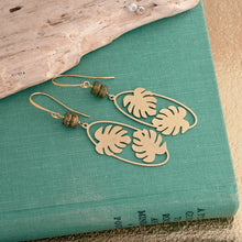 Load image into Gallery viewer, long Brass Monstera leaf Earrings - Gold textured brass and Green glass dangle earrings
