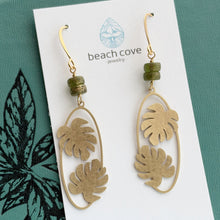 Load image into Gallery viewer, long Brass Monstera leaf Earrings - Gold textured brass and Green glass dangle earrings
