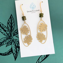 Load image into Gallery viewer, long Brass Monstera leaf Earrings - Gold textured brass and Green glass dangle earrings
