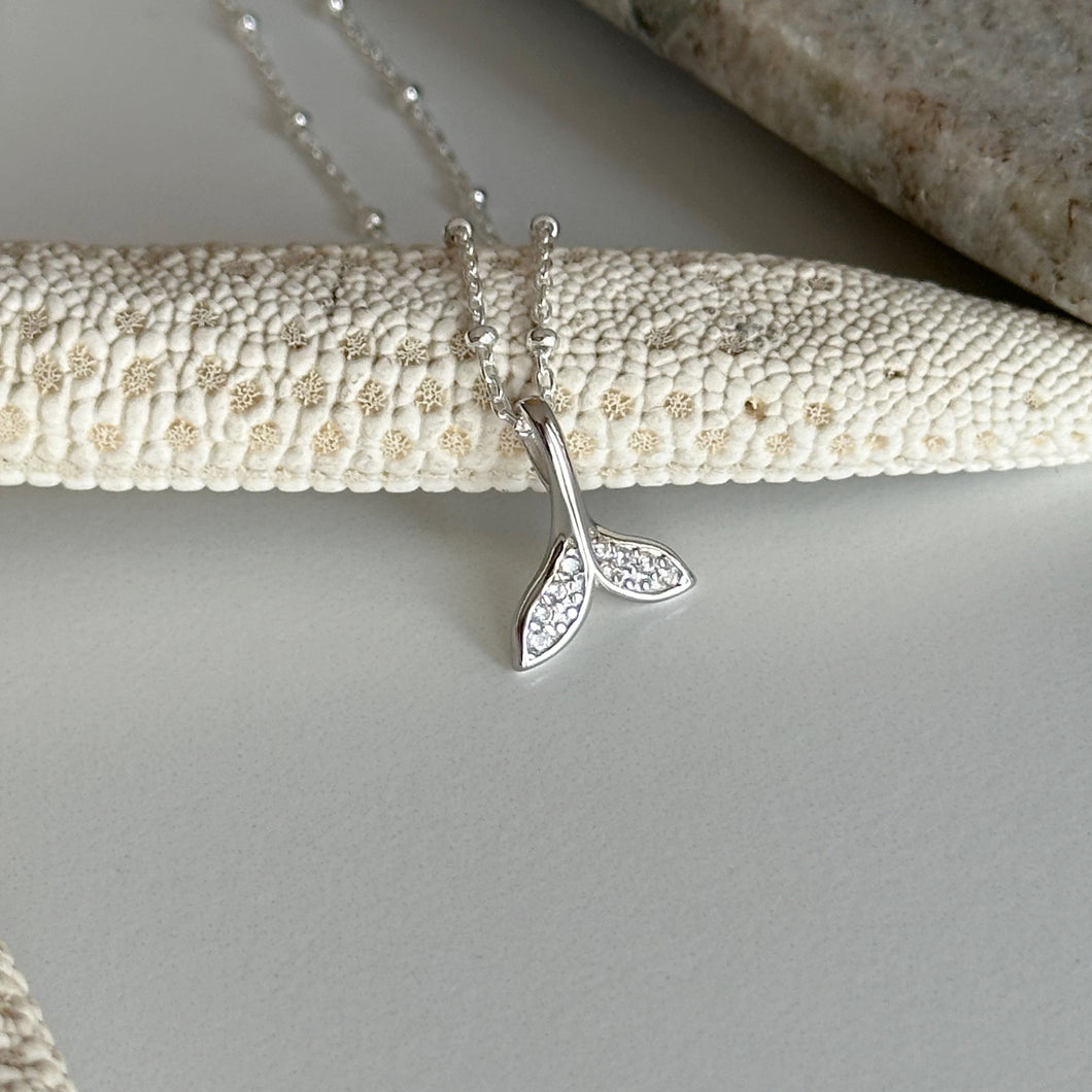 Tiny sterling silver CZ whale tail necklace