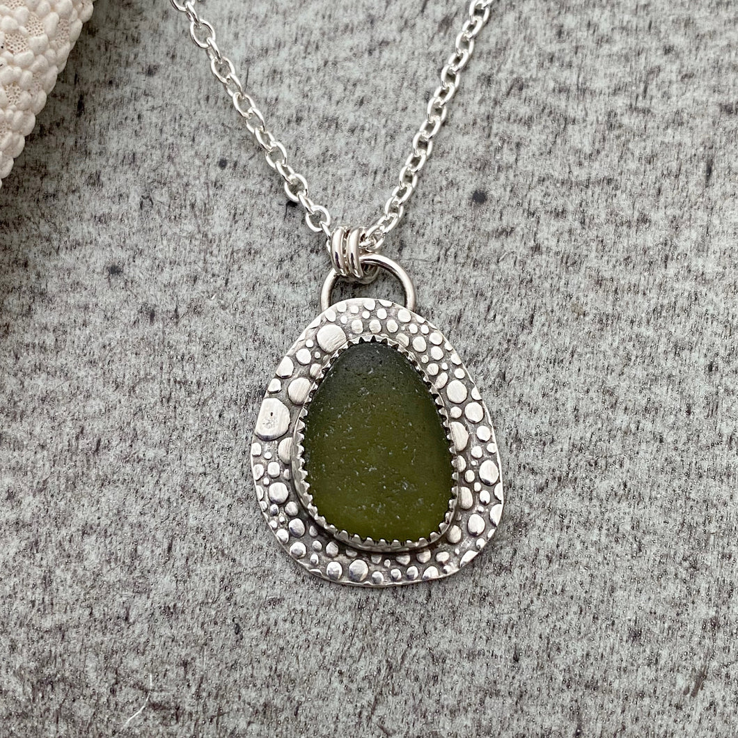 Olive Green sea glass necklace - sterling silver with bubble textured background