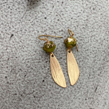 Load image into Gallery viewer, Green and gold Czech glass earrings with bronze textured wings - dangle earrings
