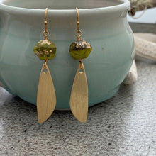 Load image into Gallery viewer, Green and gold Czech glass earrings with bronze textured wings - dangle earrings
