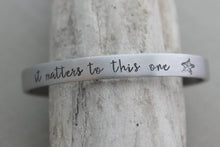 Load image into Gallery viewer, it matters to this one - Hand stamped aluminum bracelet, 1/4 Inch Bangle Silver tone Cuff Bracelet, Lightweight, Teacher Gift Idea
