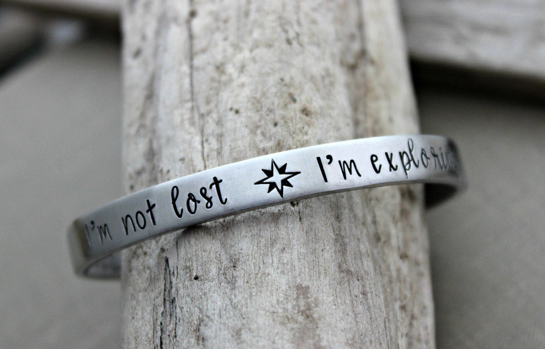 I'm not lost I'm exploring - Hand stamped aluminum bracelet - 1/4 Inch Bangle Silver tone Cuff Bracelet - Compass - Traveler - wanderer