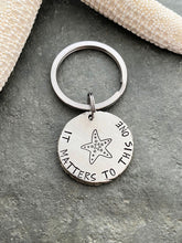 Load image into Gallery viewer, its matters to this one - starfish keychain -  Gift for teacher - silver thick pewter coin - beach keyring - adoption gift
