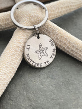 Load image into Gallery viewer, its matters to this one - starfish keychain -  Gift for teacher - silver thick pewter coin - beach keyring - adoption gift
