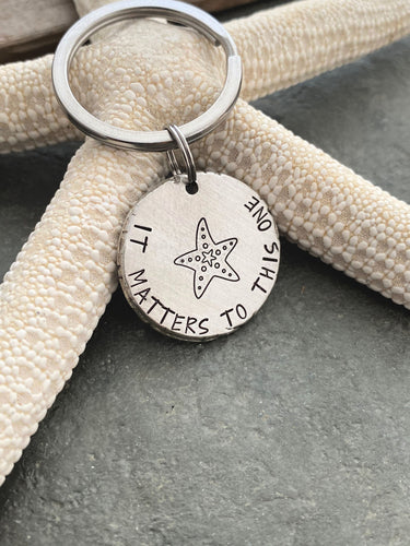 its matters to this one - starfish keychain -  Gift for teacher - silver thick pewter coin - beach keyring - adoption gift