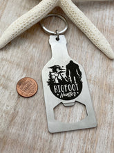 Load image into Gallery viewer, Bigfoot hunter - stainless steel beer bottle opener keychain - gift for him  -  key ring  gift for Bigfoot enthusiast - stocking stuffer
