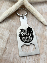 Load image into Gallery viewer, Bigfoot hunter - stainless steel beer bottle opener keychain - gift for him  -  key ring  gift for Bigfoot enthusiast - stocking stuffer

