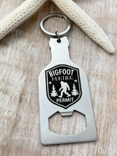 Load image into Gallery viewer, Bigfoot hunting permit - stainless steel beer bottle opener keychain - gift for him  -  key ring  gift for Sasquatch enthusiast
