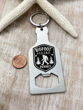 Load image into Gallery viewer, Bigfoot hunting permit - stainless steel beer bottle opener keychain - gift for him  -  key ring  gift for Sasquatch enthusiast
