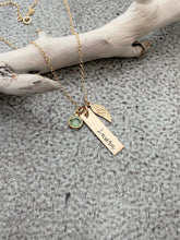 Load image into Gallery viewer, Gold tone necklace with birthstone crystal, bar with name and angel wing charm
