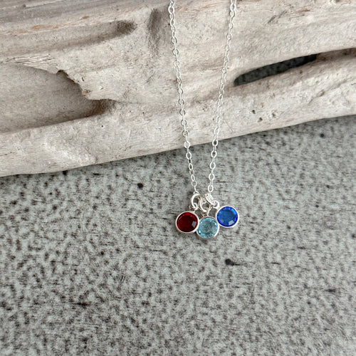 sterling silver birthstone necklace shown with three crystals