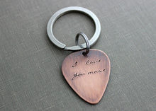 Load image into Gallery viewer, I love you more - Rustic Guitar Pick keychain,  Hand Stamped Copper Guitar Pick, 18g, Romantic Gift Idea for him - Valentine&#39;s Day gift
